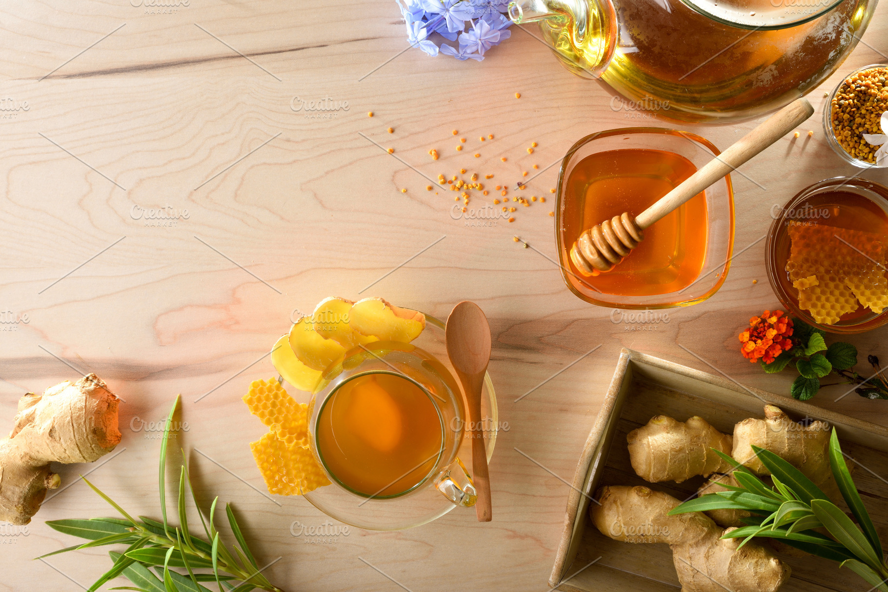 Freshly prepared ginger and honey infusion on wooden kitchen ben, a Food & Drink Photo by Davizro's Market