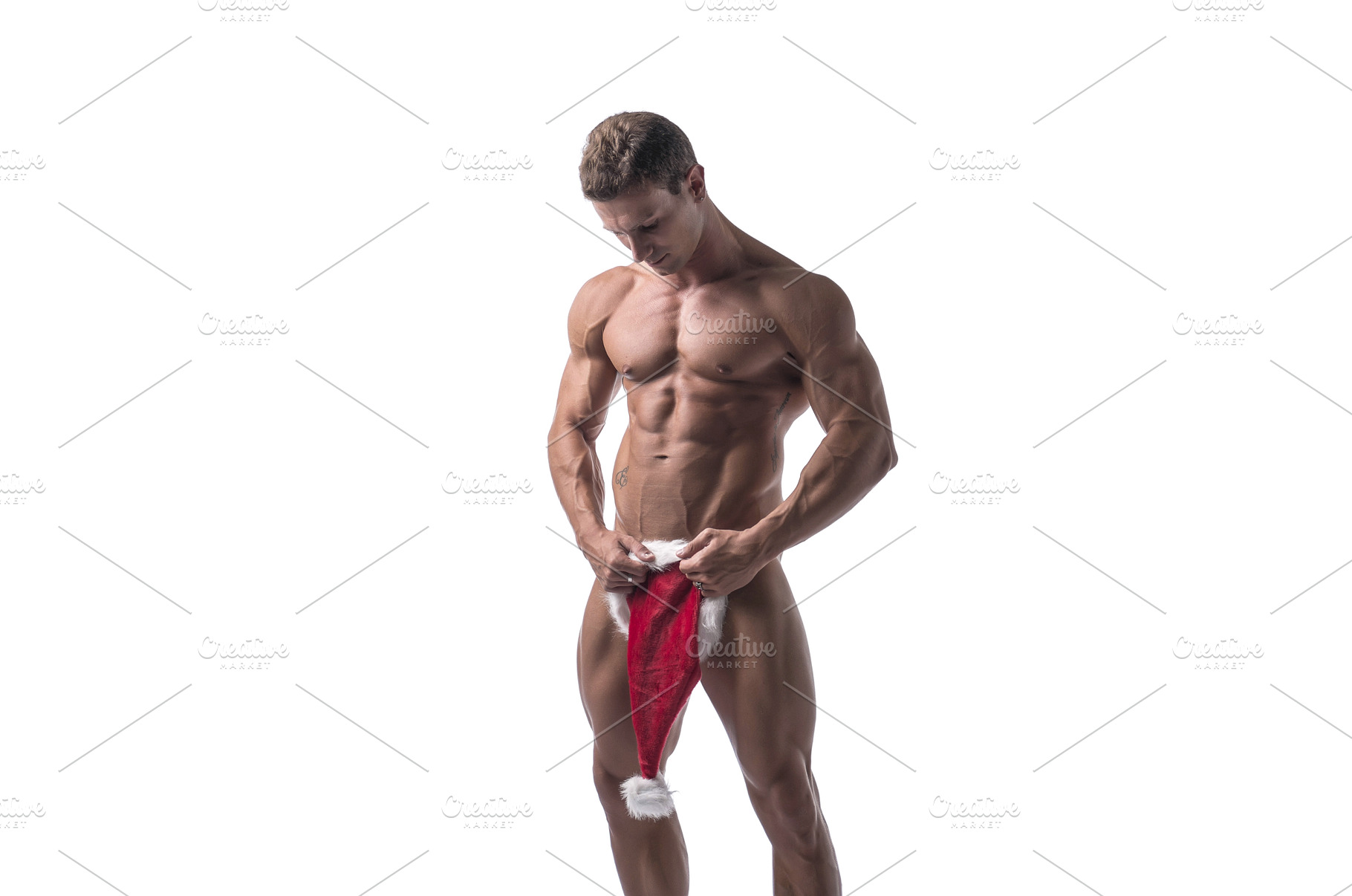 Muscle Man with Santa Claus Hat, a Person Photo by ArtOfPhotos photo store