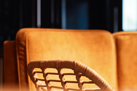Spliced arm-chair in cafe interior background