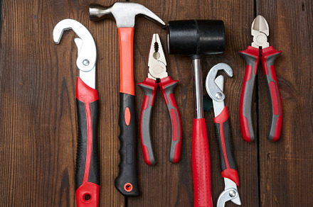 A set of construction tools on a brown wooden background, top vi, an Industrial Photo by ndanko