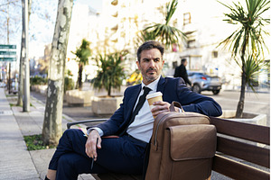 Mature businessman with takeaway