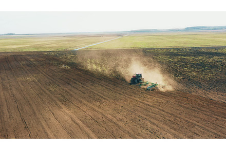 4K Aerial Elevated View.Tractor, an Industrial Photo by Our Amazing World