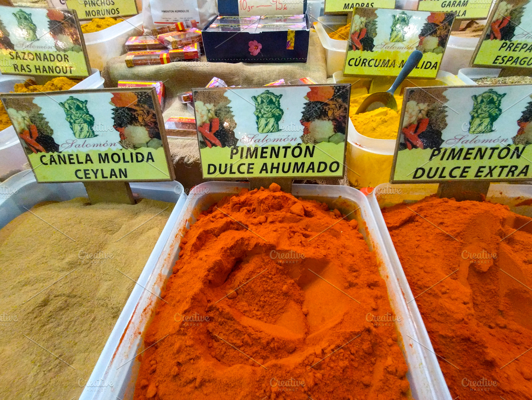 Colorful ground spices on sale at artisan food market, a Food & Drink Photo by DanFLCreativo