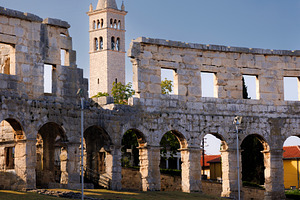 Amphitheater and bell tower of the Church of Saint Stephen, Pula, Istria, Croat, an Architecture Photo by Bepslabor