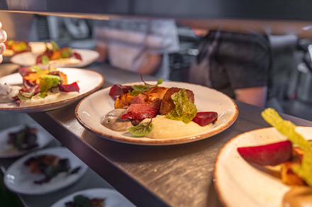 Plates with delicious roasted meat, a Photo by Grafvision photography