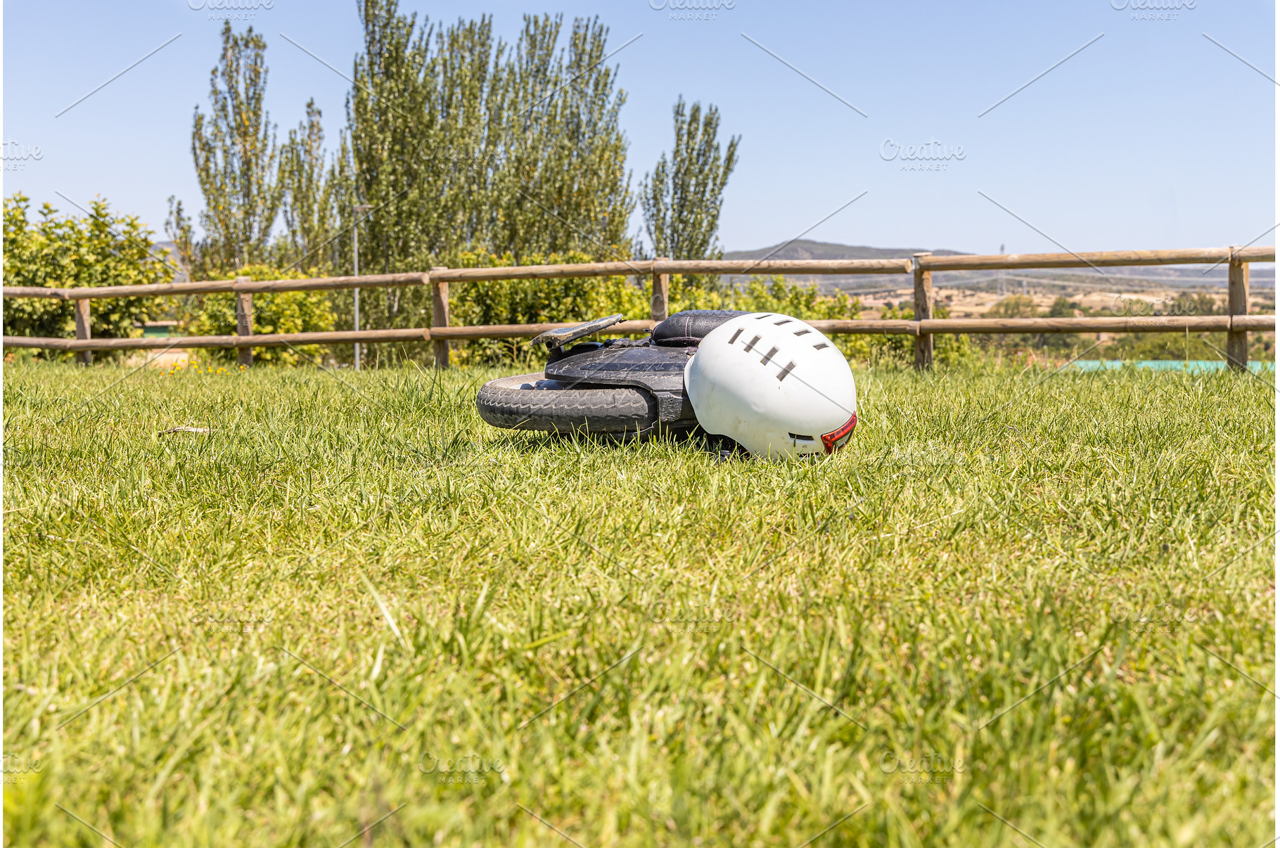 Electric unicycle with a helmet lie, a Sports & Recreation Photo by Illustrations&photos