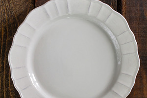 White plate, on wooden rustic background