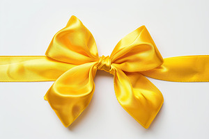 Yellow satin ribbon bow on white background, a Holiday Photo by AlyaAnd