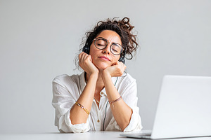 Professional woman in headset focuses on work at a modern office environment, a Person Photo by AlyaAnd