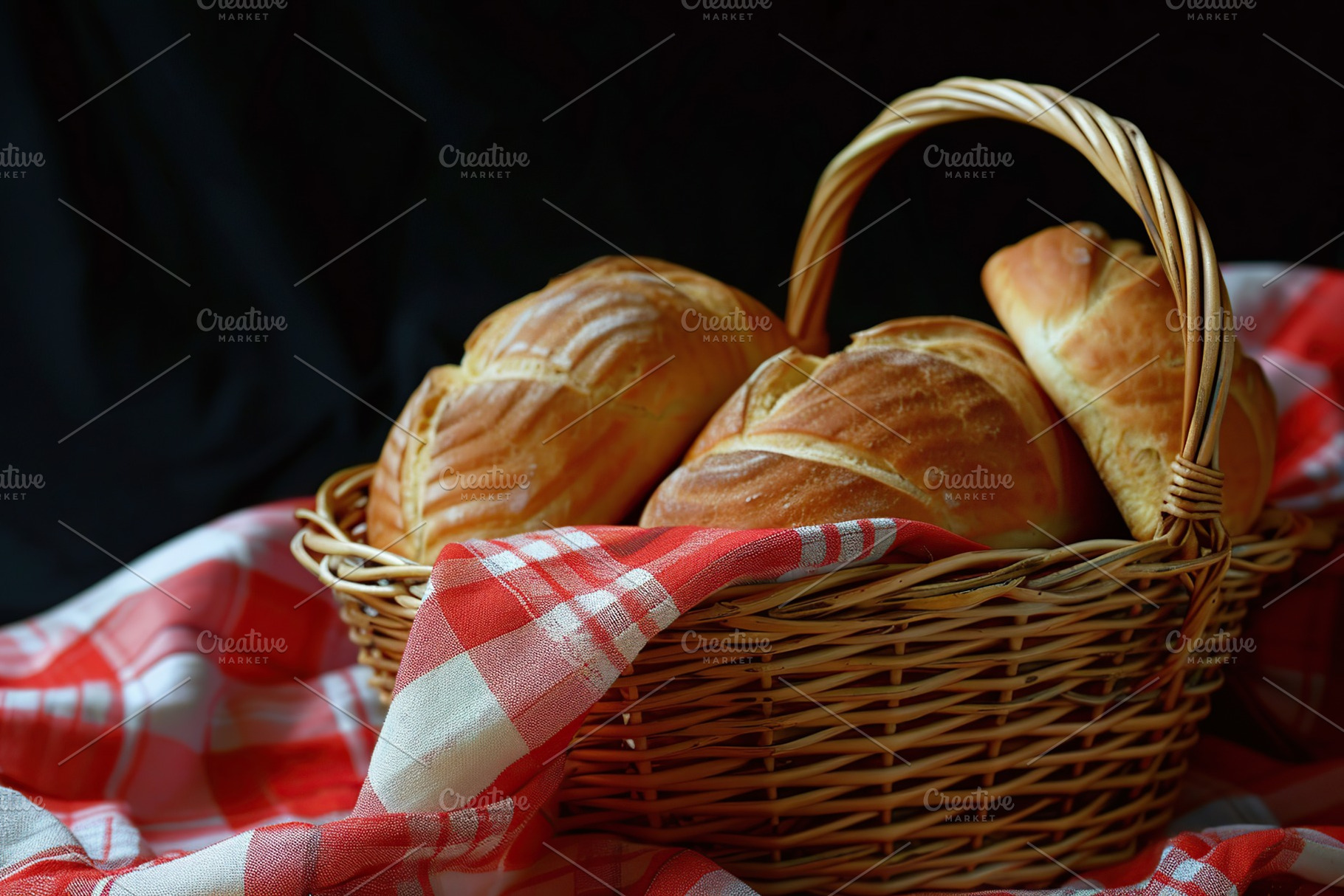 Fresh baked bread in basket on black background, a Food & Drink Photo by AlyaAnd