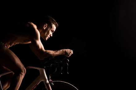 Man on bicycle preparing for triathl