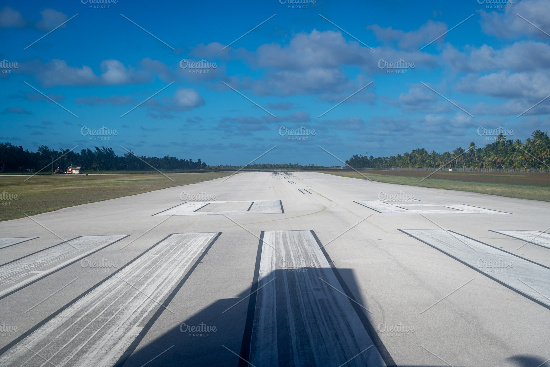 Runway of Tikehau Airport, Tuamotus, French Polynesia under a bl, a Transportation Photo by GoodGoods