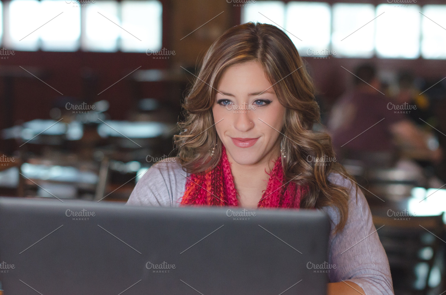 Attractive woman using a laptop, a Person Photo by Androo Interactive