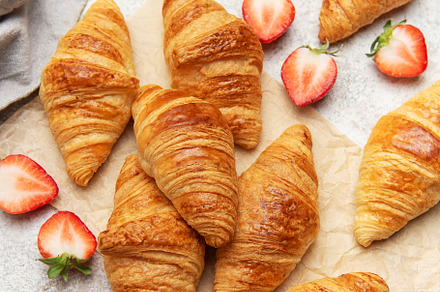 Freshly baked croissants with strawberries and honey for breakfa, a Food & Drink Photo by Olena Rudo