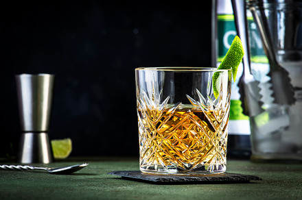 White negroni cocktail with dry gin, white vermouth and herbal a, a Food & Drink Photo by 5PH