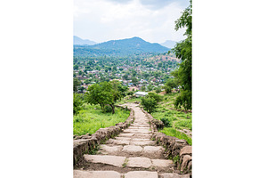 Mountain view path to scenic village, a Nature Photo by Lermont51