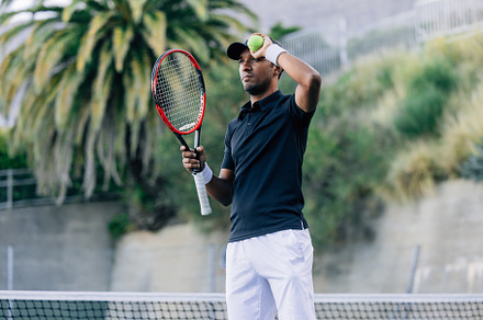 Young man with a tennis racket, a Sports & Recreation Photo by Artem Varnitsin