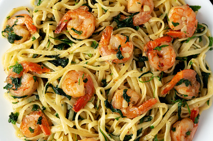 Homemade One-Pot Lemon Garlic Shrimp Pasta on a Plate on a black, a Food & Drink Photo by LiudmylaChuhunova
