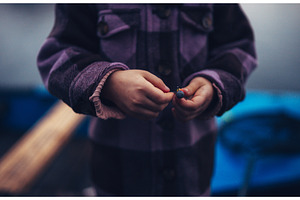 Close up on hands of young fisherman, a Sports & Recreation Photo by HalfPoint