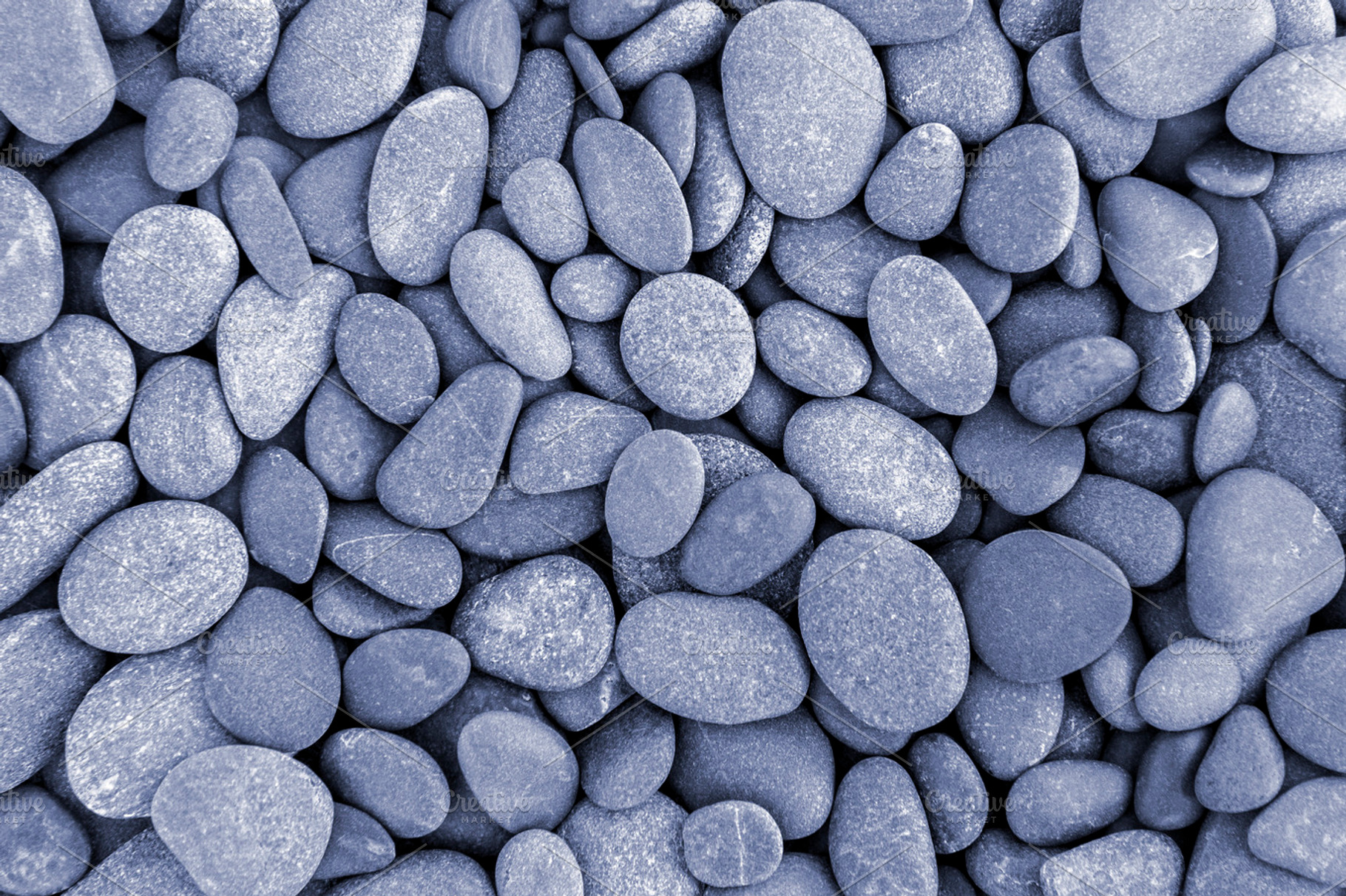 Natural pebble stone background, an Abstract Photo by BOOCYS