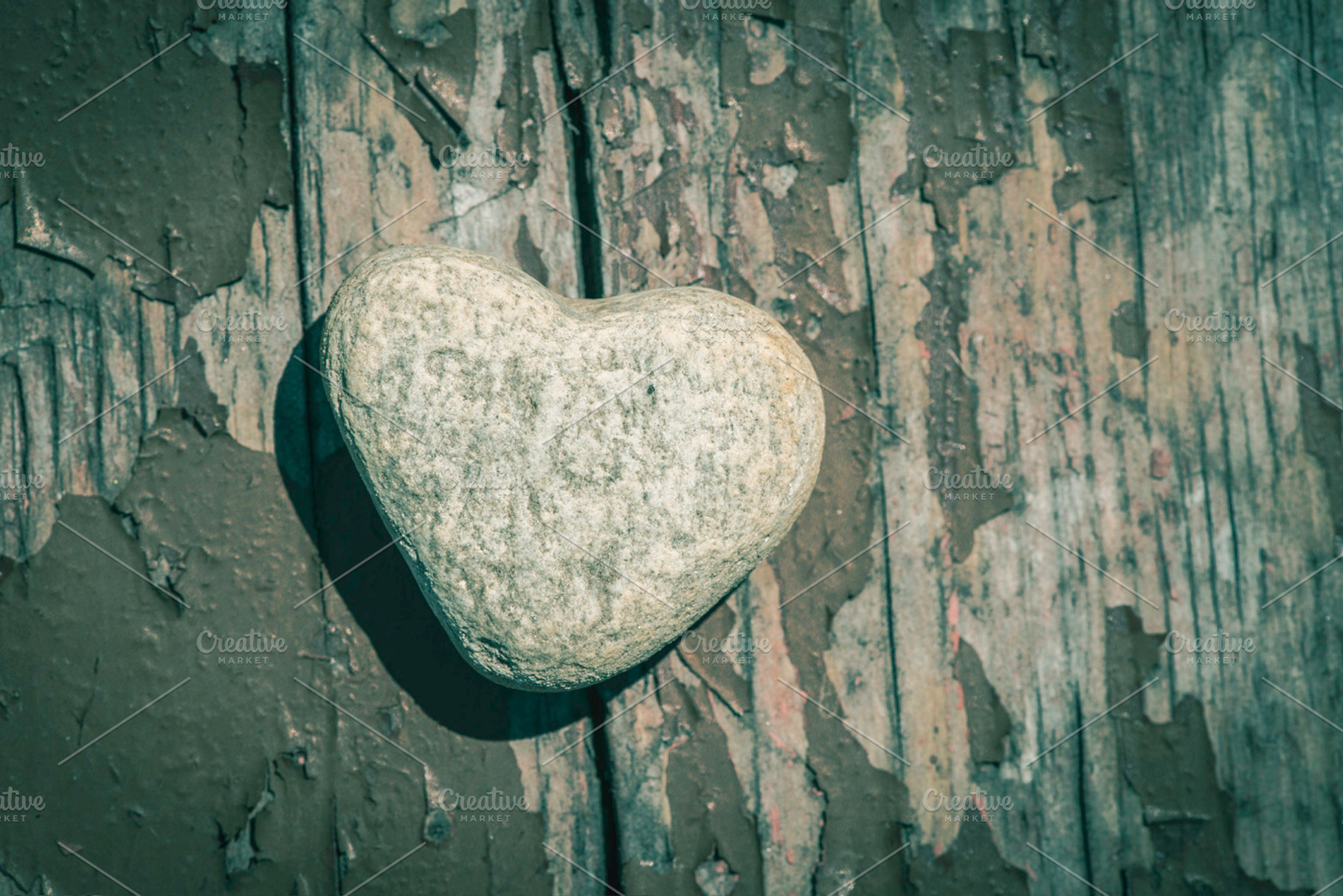 Stone heart shape on wood stock photo containing heart and stone, a Nature Photo by Deyan Georgiev