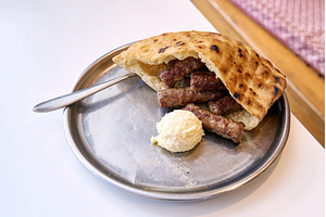 Sarajevo-style cevapi aka Sarajevski, a Food & Drink Photo by Oleksandr Berezko