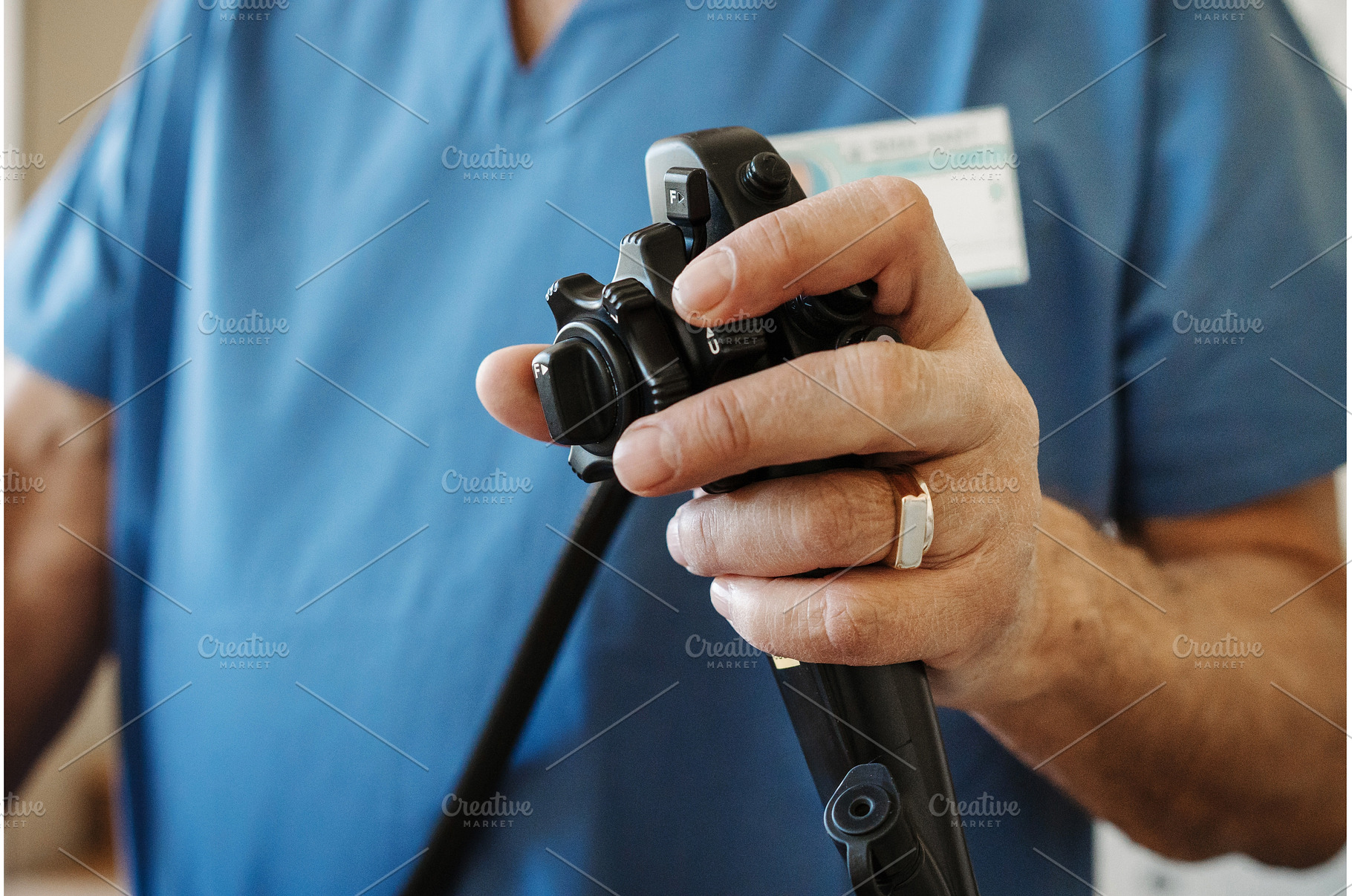 Close-up of doctor holding endoscope, a Health & Medical Photo by HalfPoint