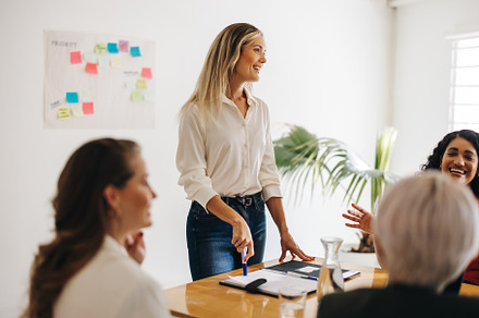 Successful businesswomen having a meeting in an office, a Person Photo by Jacob Lund