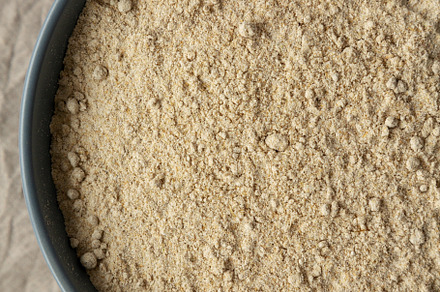 Organic White Oat Flour in a Bowl on a gray background, top view, a Food & Drink Photo by LiudmylaChuhunova