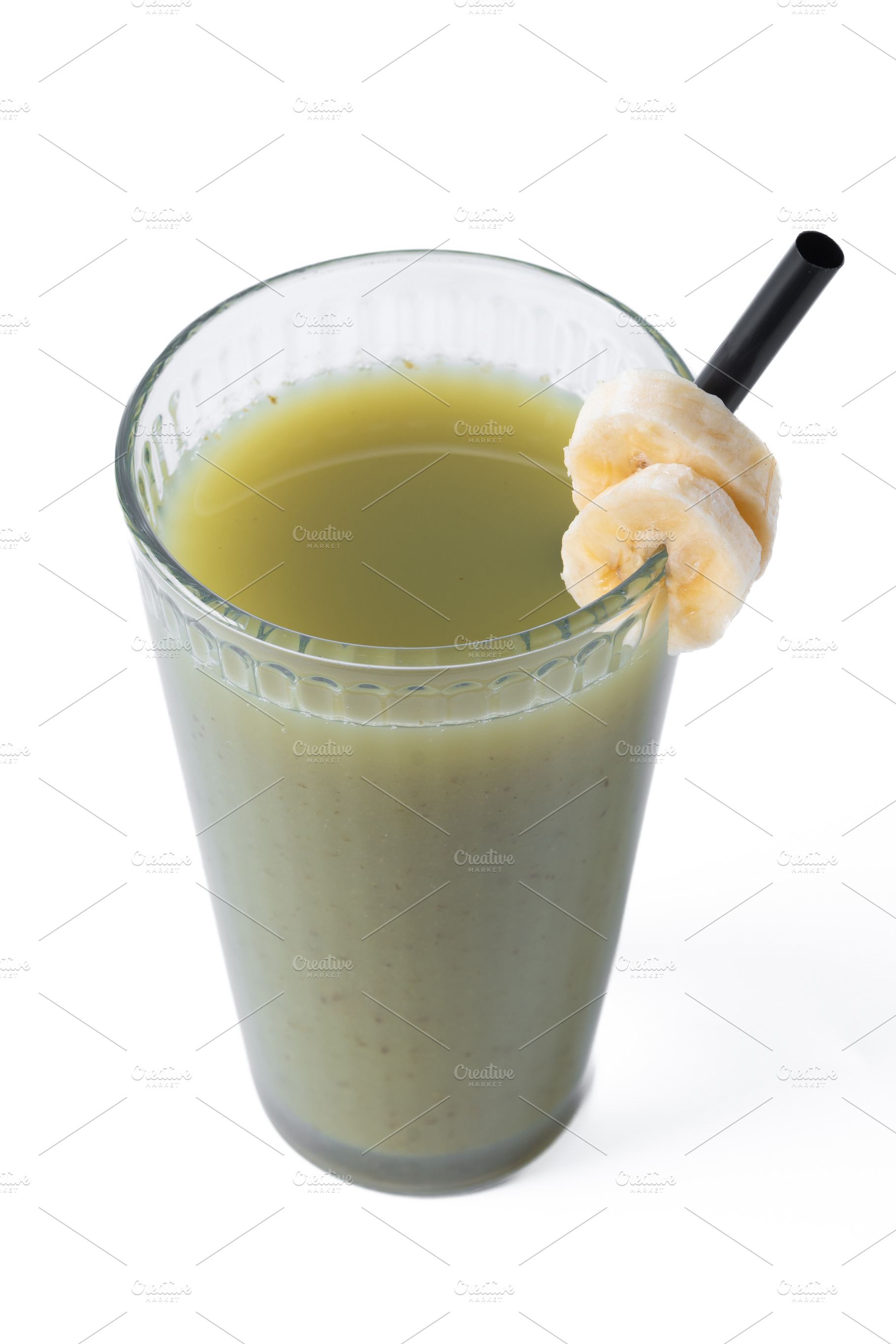 Green smoothie with spinach,banana, apple, and lemon isolated on, a Food & Drink Photo by etorres69