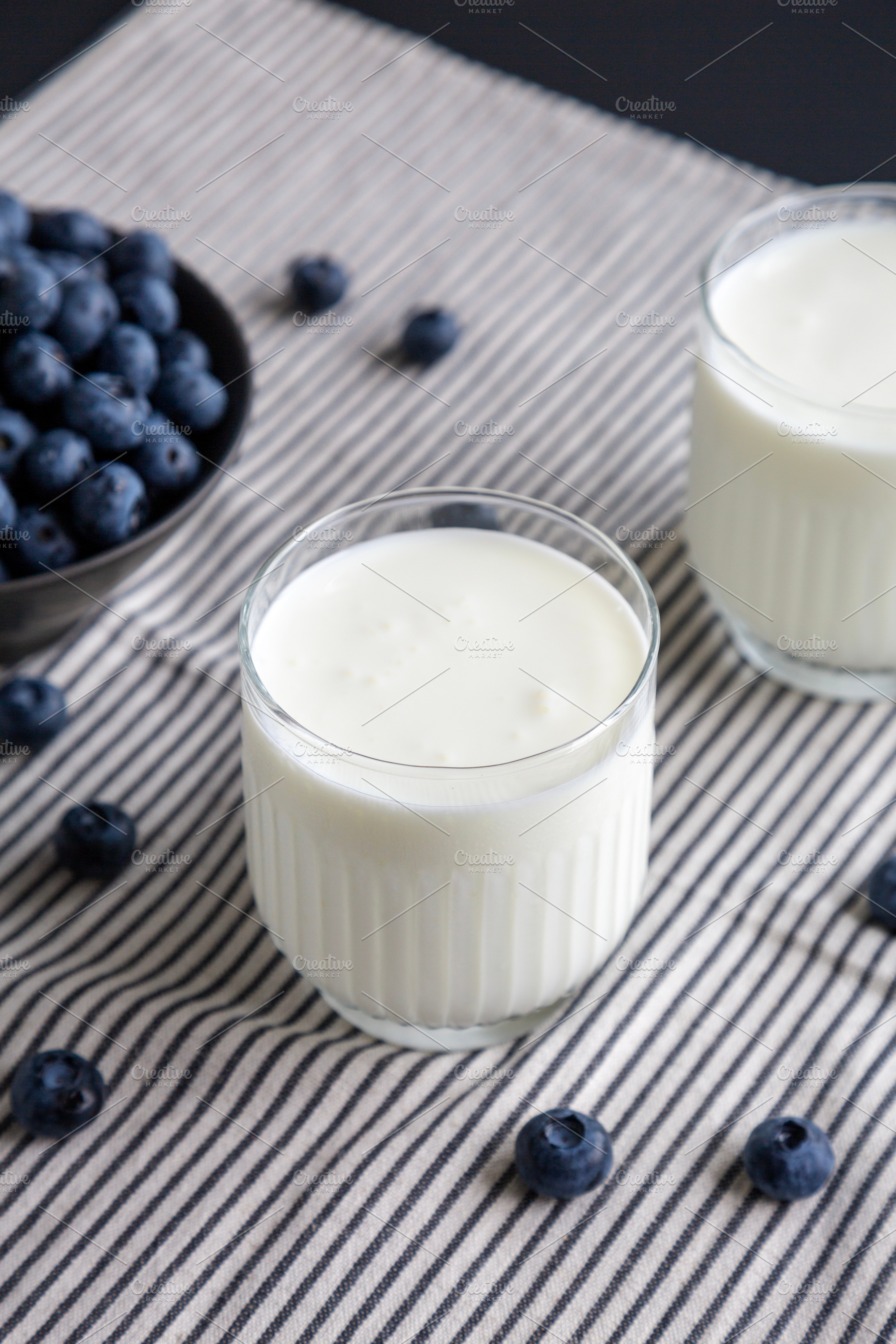 Organic Blueberry Kefir in a Glass, side view., a Food & Drink Photo by LiudmylaChuhunova