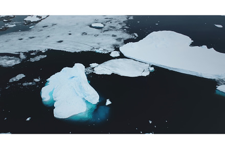 Icebergs from melting glacier float