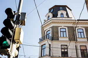 Classic architecture and street elements in Lviv with clear blue skies, a Photo by AS photostudio