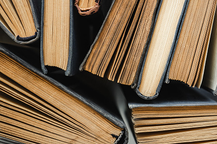 Stack of vintage books lying on the table, a School & Education Photo by Svetlana Barchan
