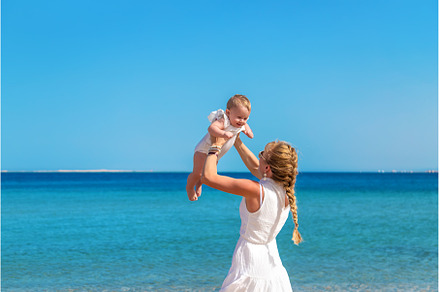 Mother with her daughters at sea, a Person Photo by yanadjana