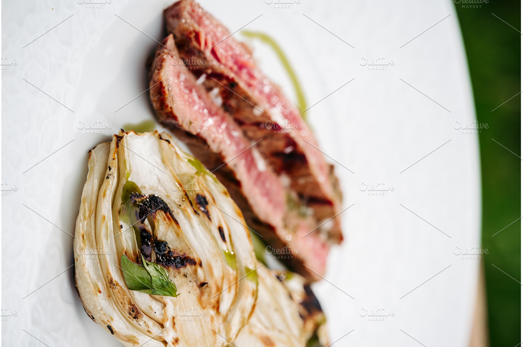 Gourmet outdoor meal of juicy steak, a Food & Drink Photo by HalfPoint