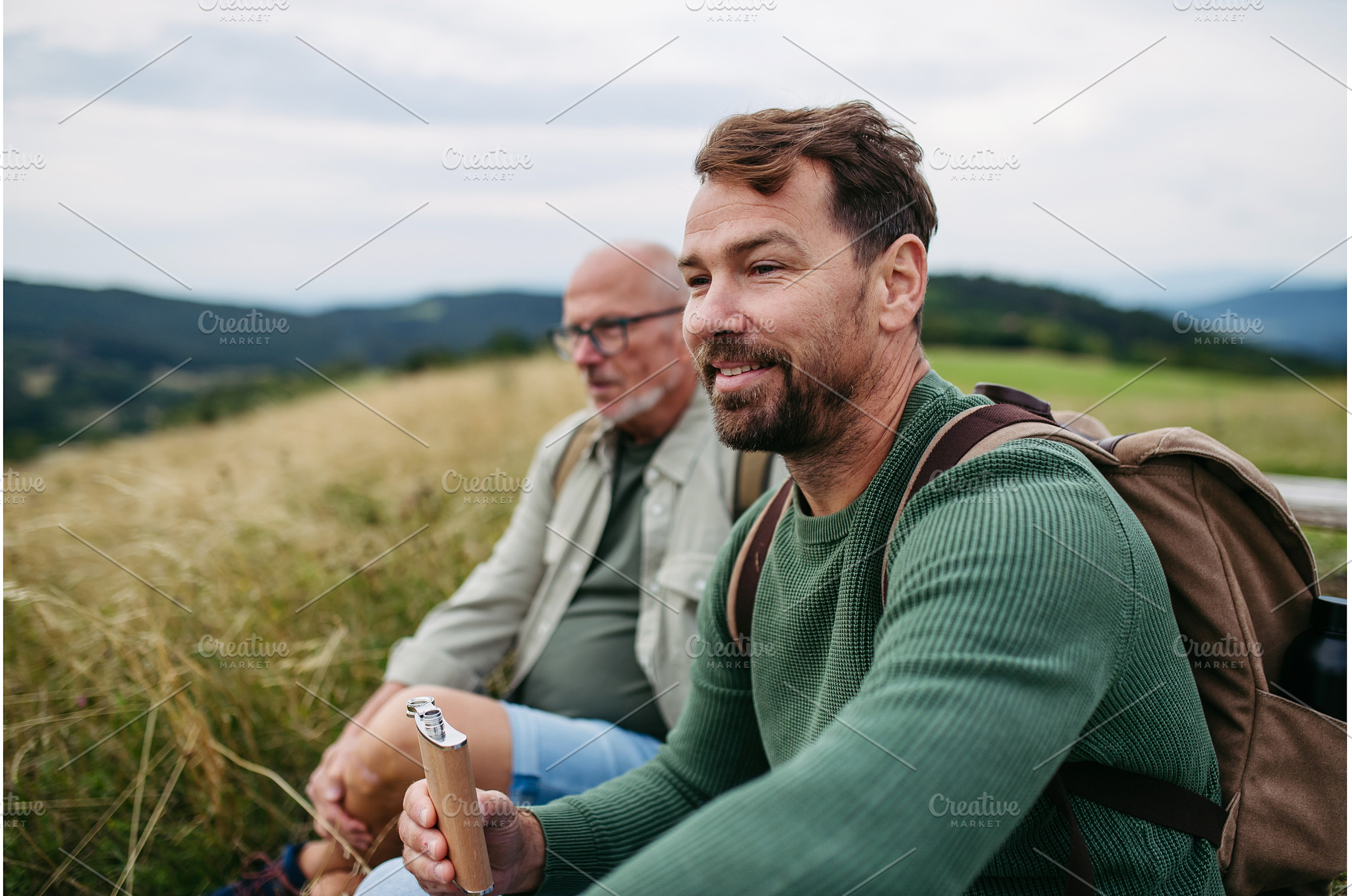 Mature son and his dad resting, a Person Photo by HalfPoint