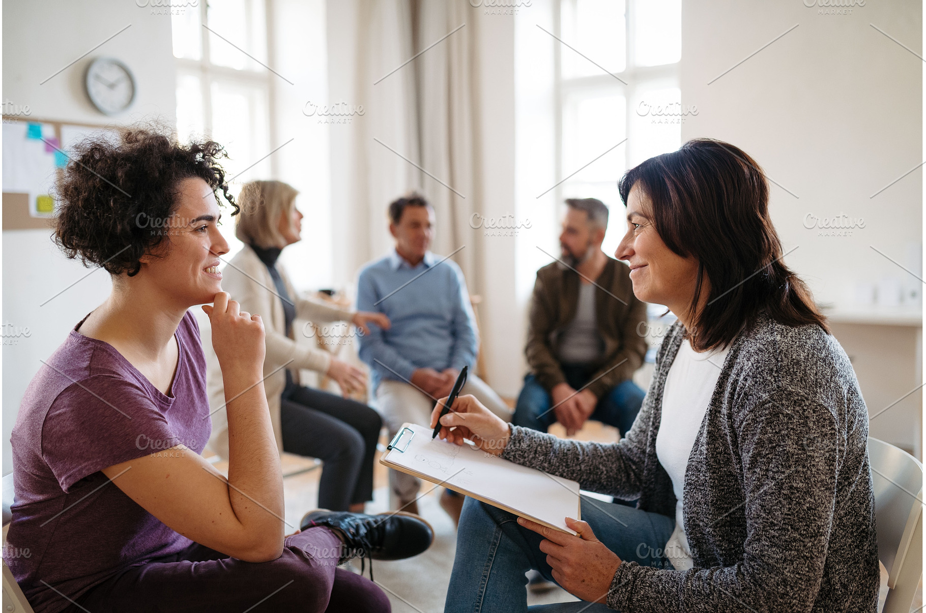 Woman talking with psychologist, a Person Photo by HalfPoint