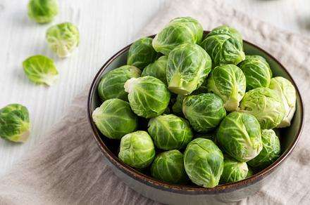 Raw Organic Brussel Sprouts in a Bowl, low angle view., a Food & Drink Photo by LiudmylaChuhunova