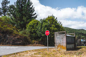 Stop sign by rural road, bus stop, a Transportation Photo by SkyNext