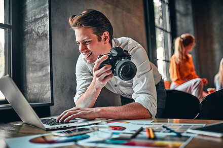 Young cheerful photographer, a Photo by ORION Production