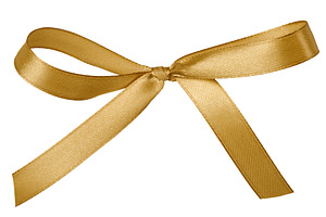 Golden satin ribbon bow on isolated background, a Holiday Photo by ndanko