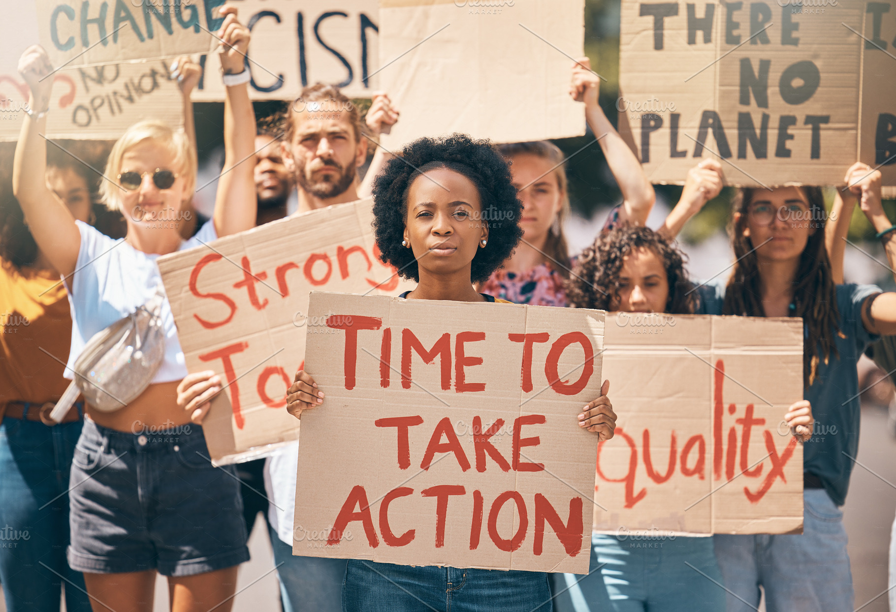 Group, protest and portrait in street, poster or climate change with march, walking or together for change. People, diversity or action in activism, equality or empowerment for racism, lgbt and earth, a Photo by Peopleimages.com