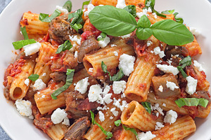 Rigatoni alla Norma pasta with eggplant and tomato, basil and ricotta salata, h, a Food & Drink Photo by iuliia_n