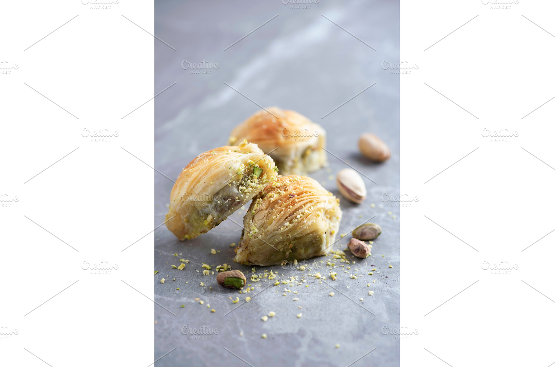 Baklava with pistachios on grey, a Food & Drink Photo by Enjoy Photo