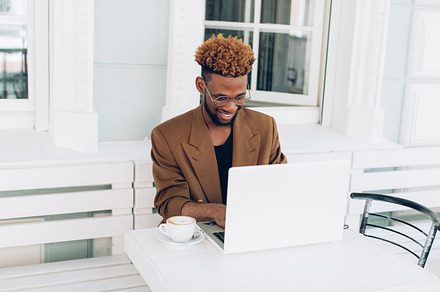 A business african american man containing handsome, laptop, and cafe, a Business Photo by Cherkas Photography