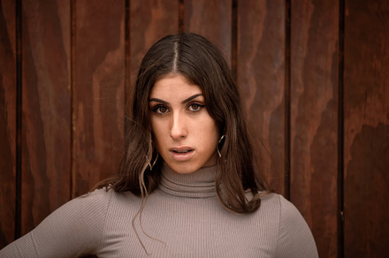 caucasian girl looking straight ahea, a Photo by Perpis