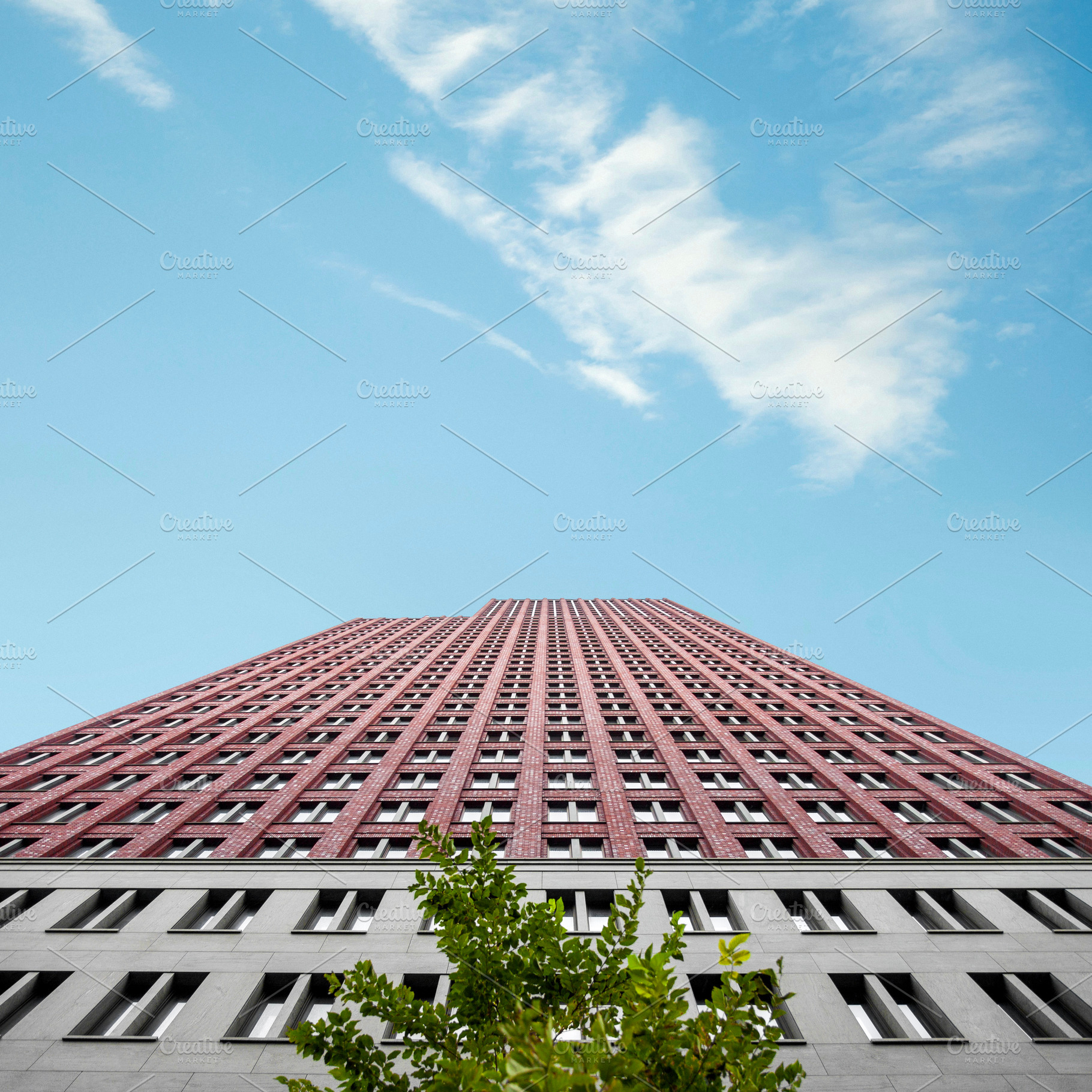 Low angle view on modern skyscraper, an Architecture Photo by BOOCYS