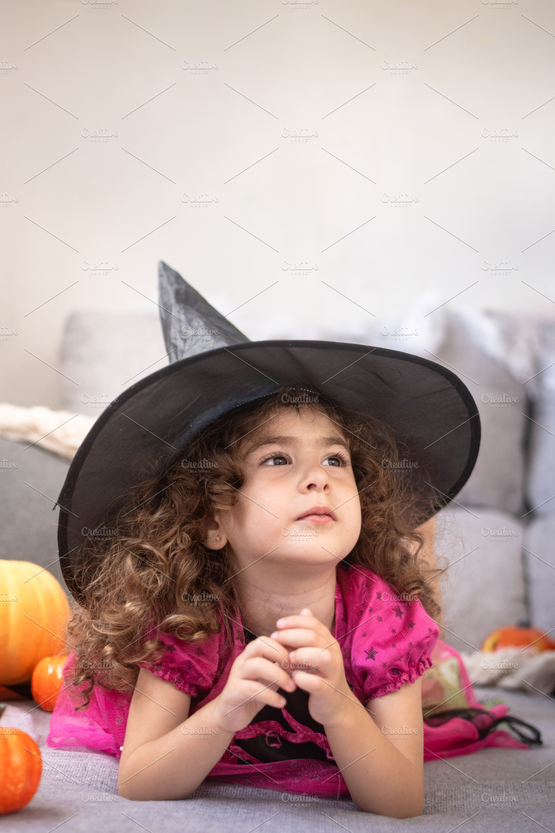 Little Girl in Witch Costume Looking Up Indoors, a Person Photo by etorres69