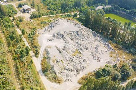 Aerial view of machine excavator trucks dig coal mining or ore w, a Background Photo by Tampatra